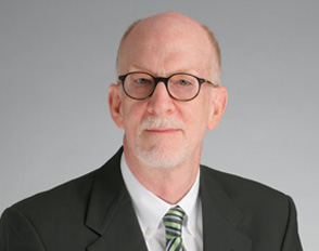 Thomas H. May headshot.